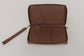 Pairre 4P passport wallet in brwn leather — open interior showing four passport slots and boarding pass pocket