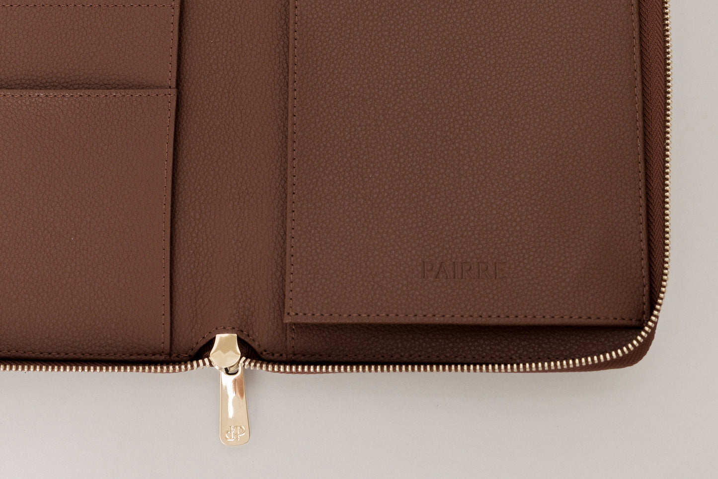 Close up - pairre 4p - boarding pass sleeve - debossed PAIRRE logo - close up pvd hardware