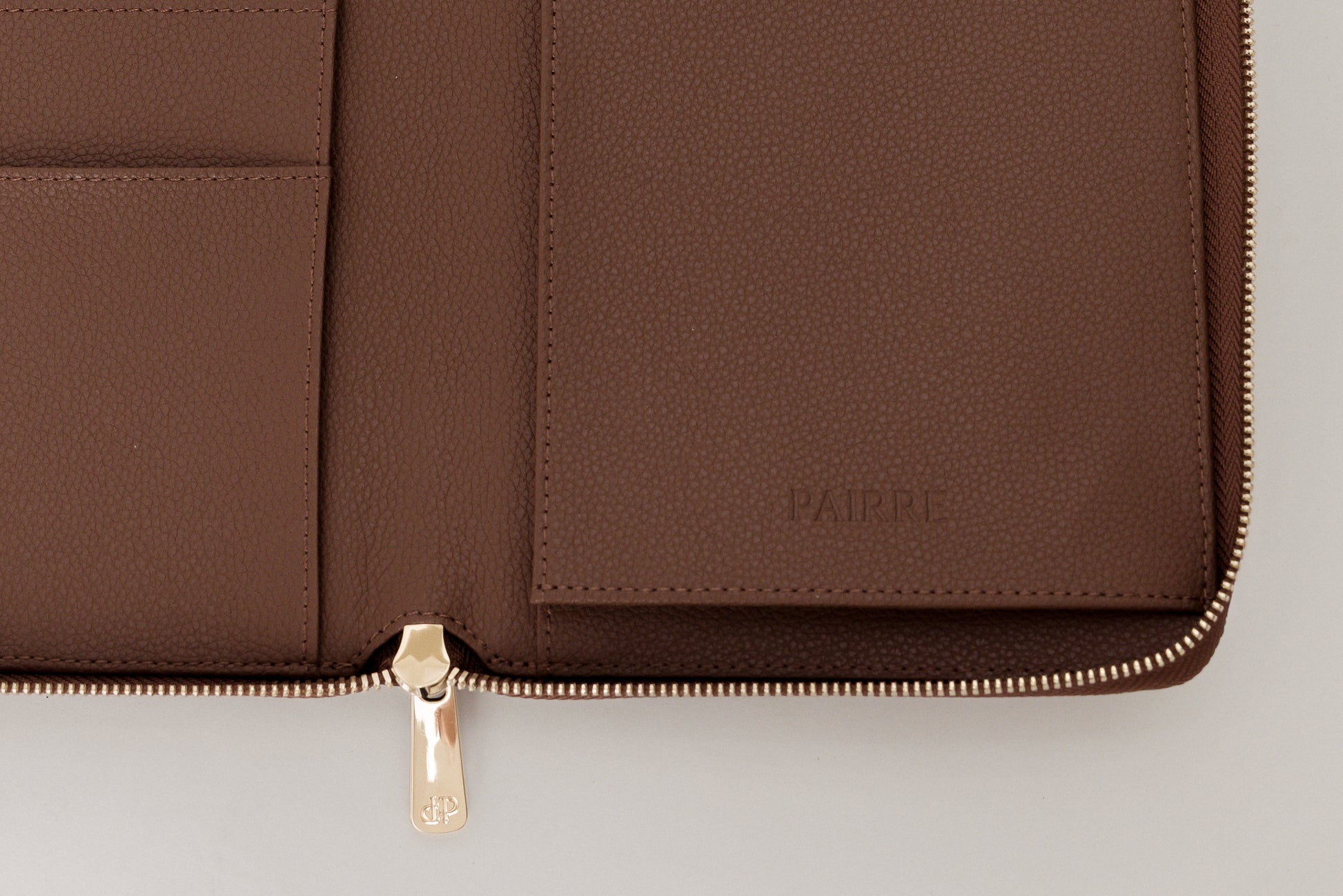 Close up - pairre 4p - boarding pass sleeve - debossed PAIRRE logo - close up pvd hardware
