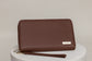 Pairre 4P passport wallet in brown full-grain leather — closed exterior showing PVD gold hardware