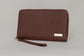 Pairre 4P passport wallet in brown full-grain leather — closed exterior showing PVD gold hardware