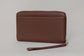 Pairre 4P passport wallet in brown full-grain leather — closed exterior showing PVD gold hardware - rear slip pocket