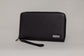 Pairre 4P passport wallet in black full-grain leather — closed exterior showing PVD gold hardware