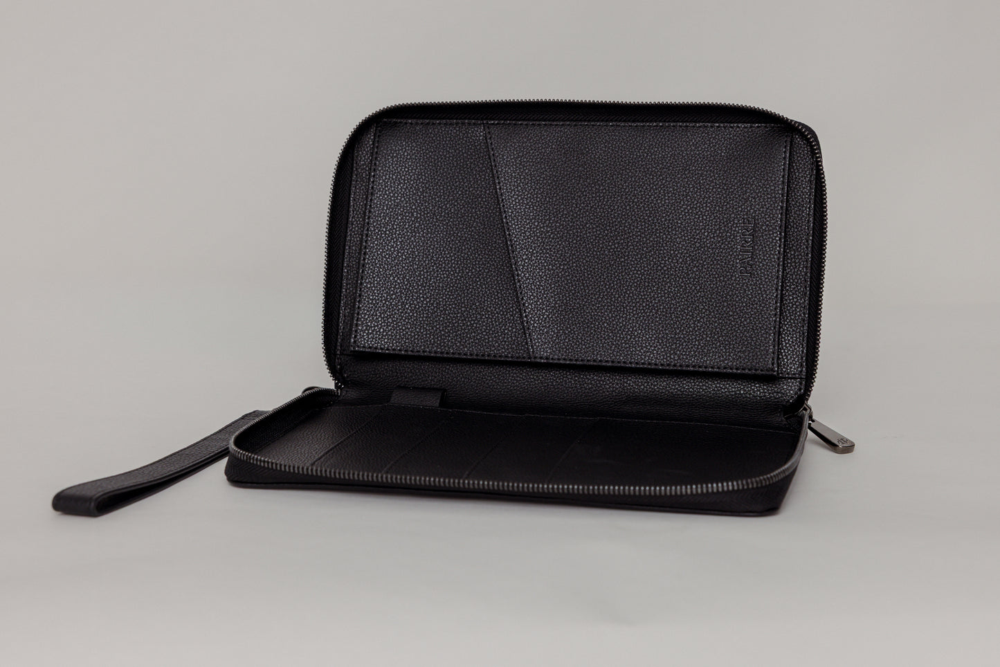 Pairre 4P passport wallet in black leather — open interior showing four passport slots and boarding pass pocket