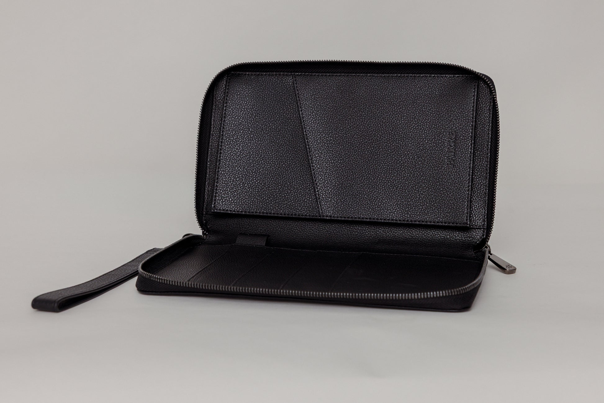 Pairre 4P passport wallet in black leather — open interior showing four passport slots and boarding pass pocket