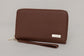 Pairre 2P brown/espresso leather passport wallet - close up of PVD gold Pairre hardware plate