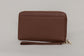 Pairre 2P passport wallet in brown full-grain leather - closed exterior showing PVD gold hardware