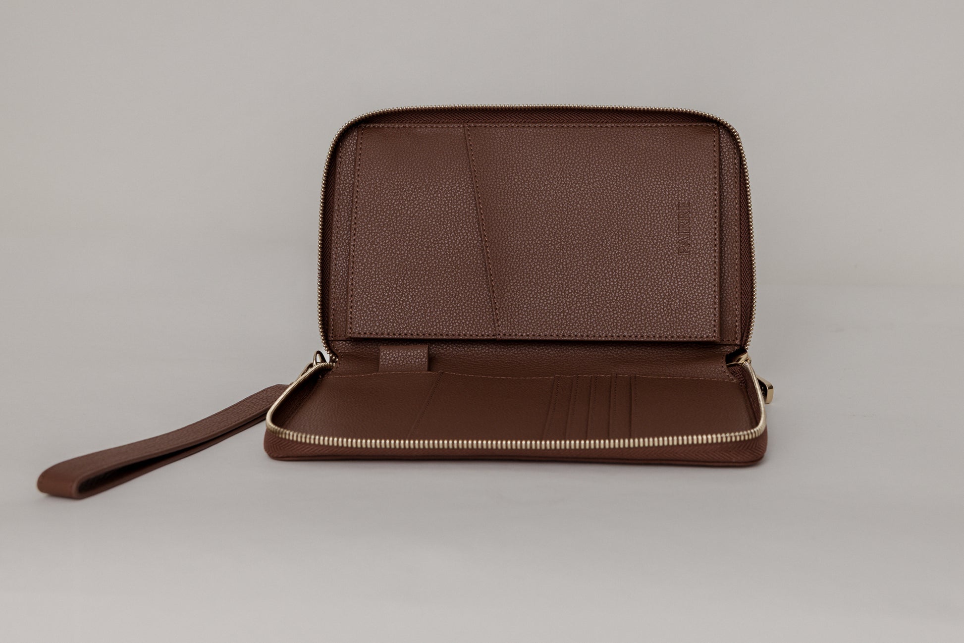 Pairre 2P passport wallet in brown leather - open interior showing passport slots and card pockets