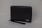 Pairre 8P passport wallet in black full-grain leather — closed exterior showing PVD gold hardware