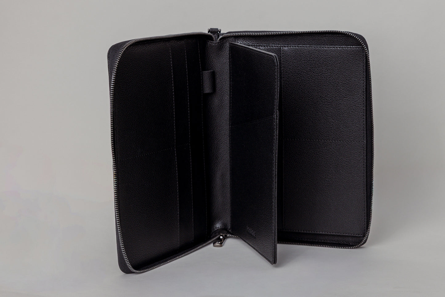 Pairre 8P passport wallet in black leather — open interior showing eight passport slots and document sleeves