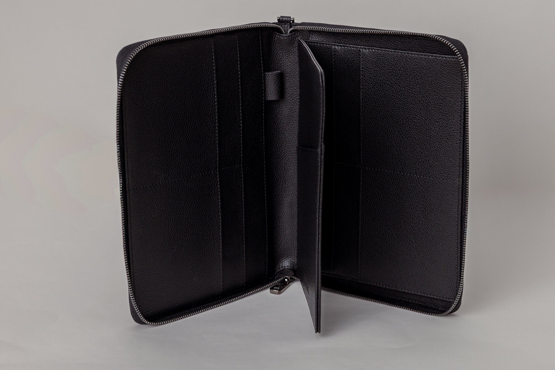 Pairre 8P passport wallet in black leather — open interior showing eight passport slots and document sleeves