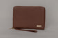 Pairre 8P passport wallet in brown full-grain leather — closed exterior showing PVD gold hardware