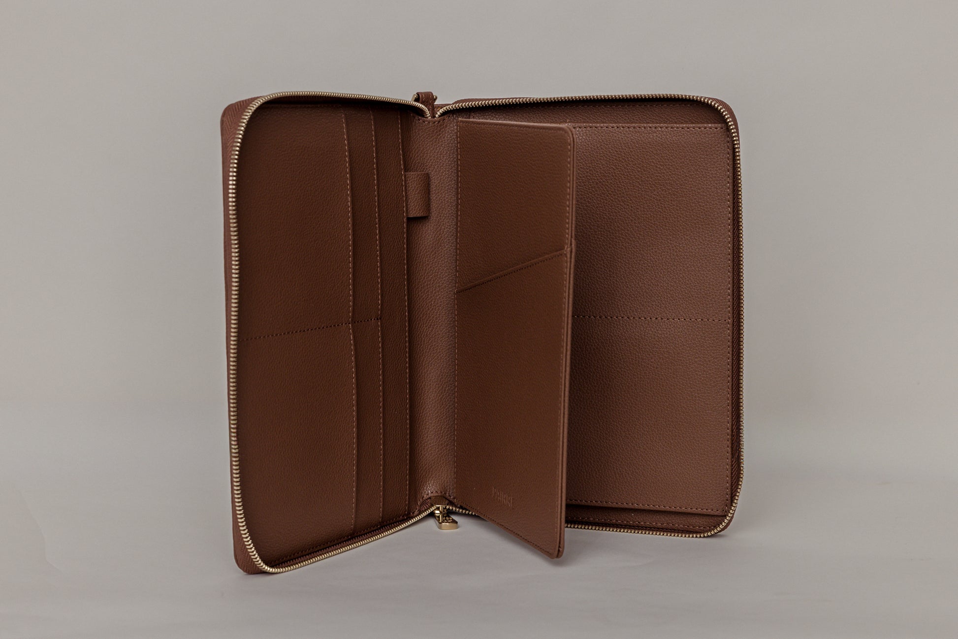 Pairre 8P passport wallet in brown leather — open interior showing eight passport slots and document sleeves