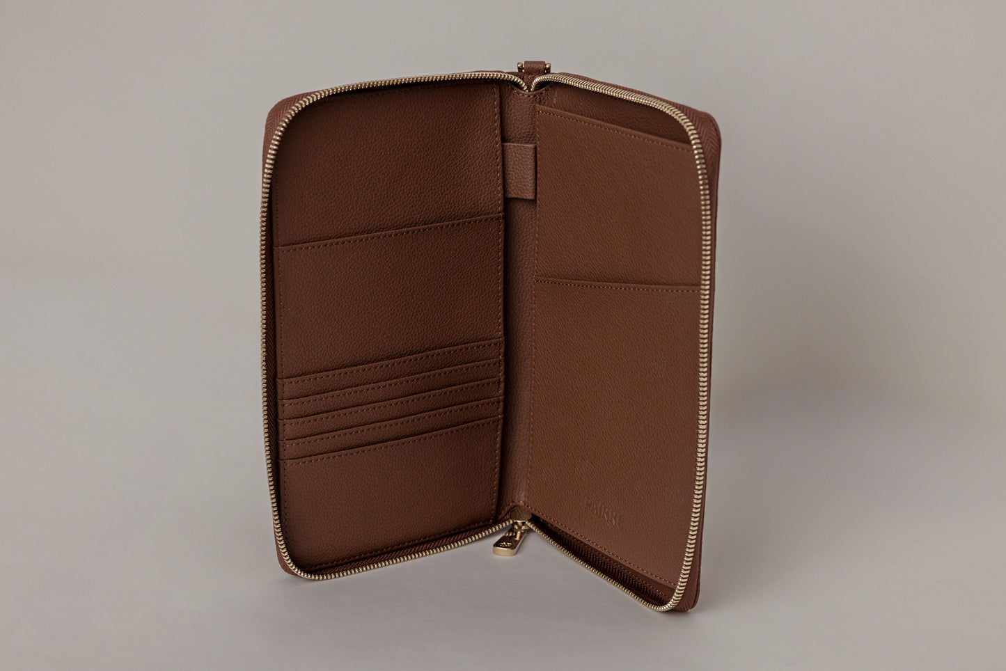 Pairre 2P passport wallet in brown leather - open interior showing passport slots and card pockets