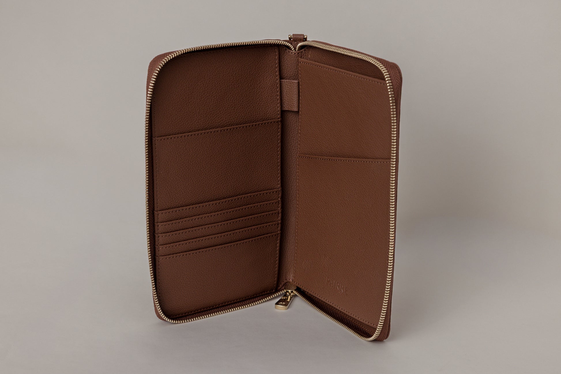 Pairre 2P passport wallet in brown leather - open interior showing passport slots and card pockets
