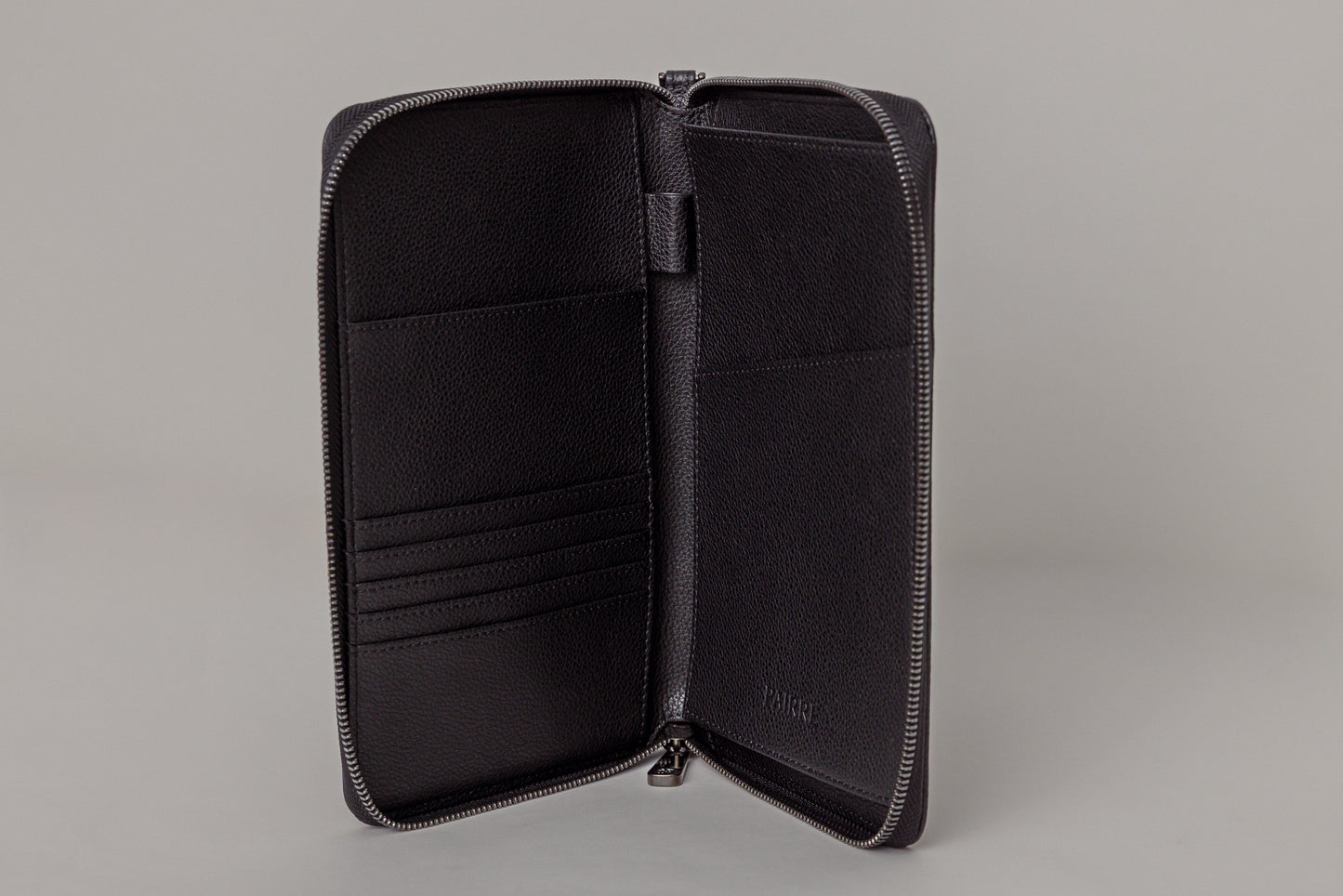 Pairre 2P passport wallet in black leather - open interior showing passport slots and card pockets