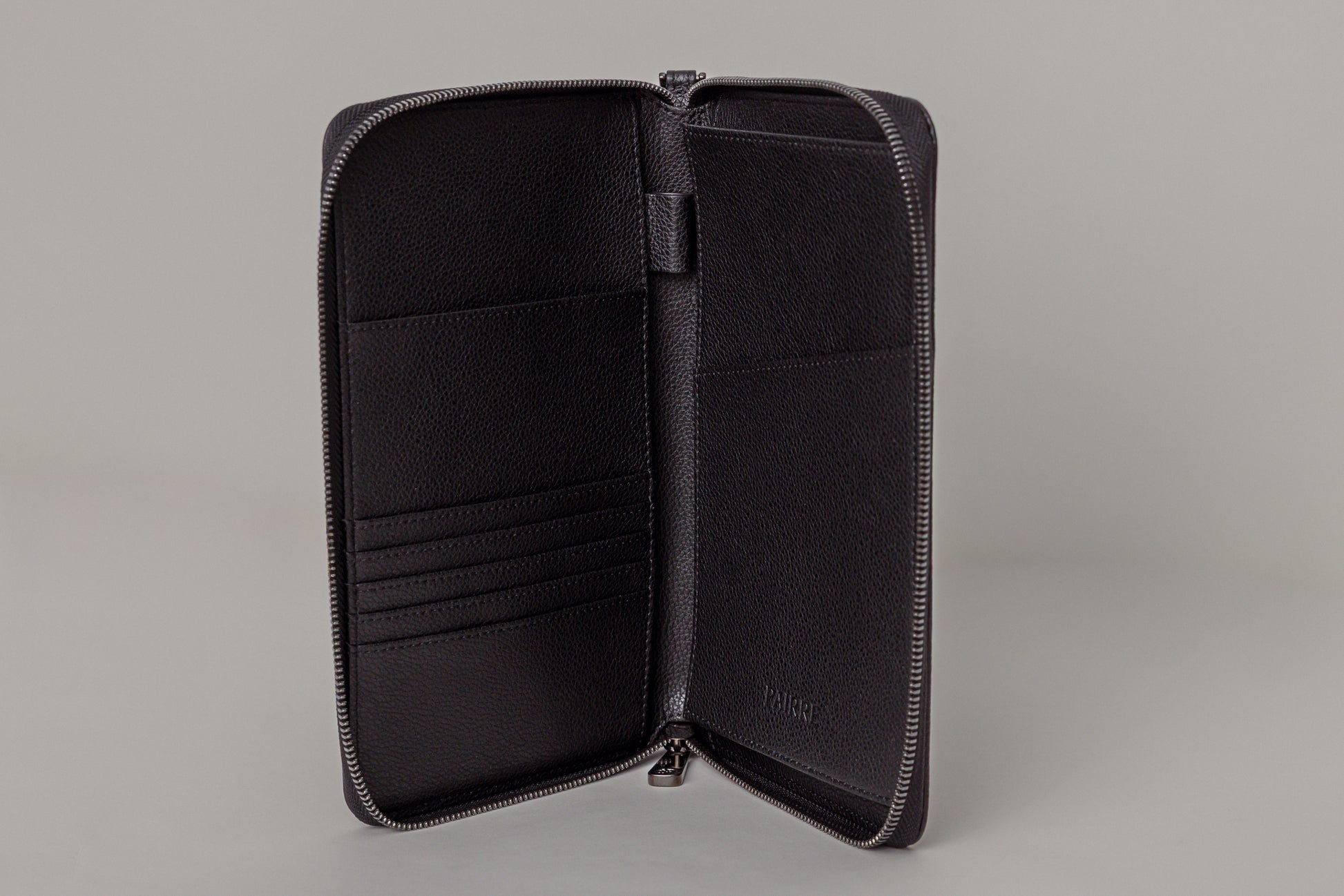 Pairre 2P passport wallet in black leather - open interior showing passport slots and card pockets