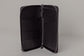 Pairre 2P passport wallet in black leather - open interior showing passport slots and card pockets