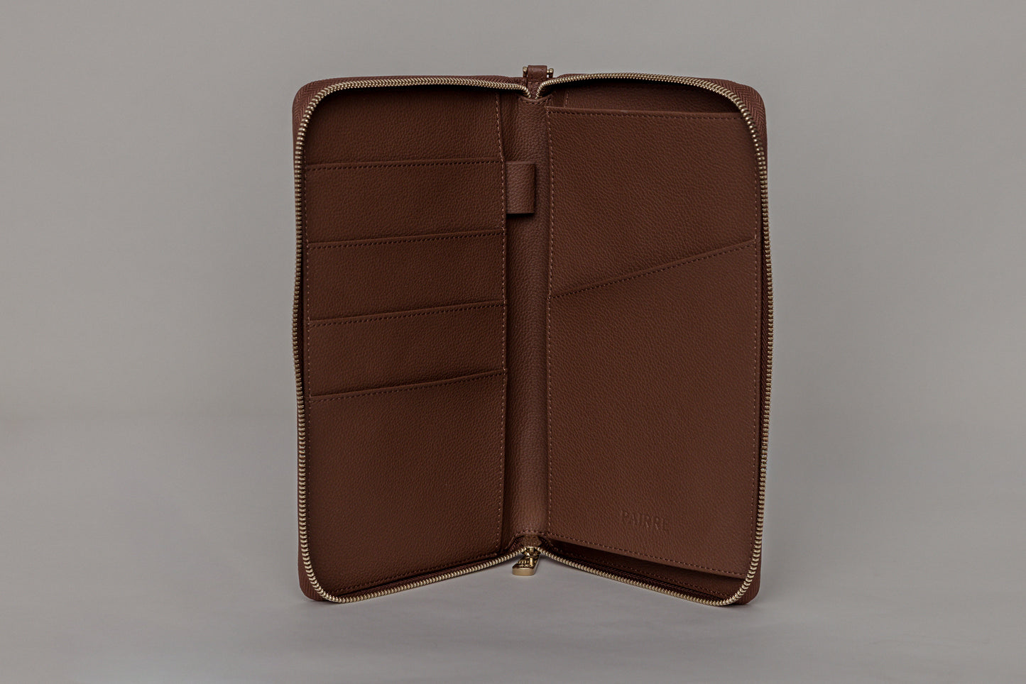 Pairre 4P passport wallet in brown leather — open interior showing four passport slots and boarding pass pocket