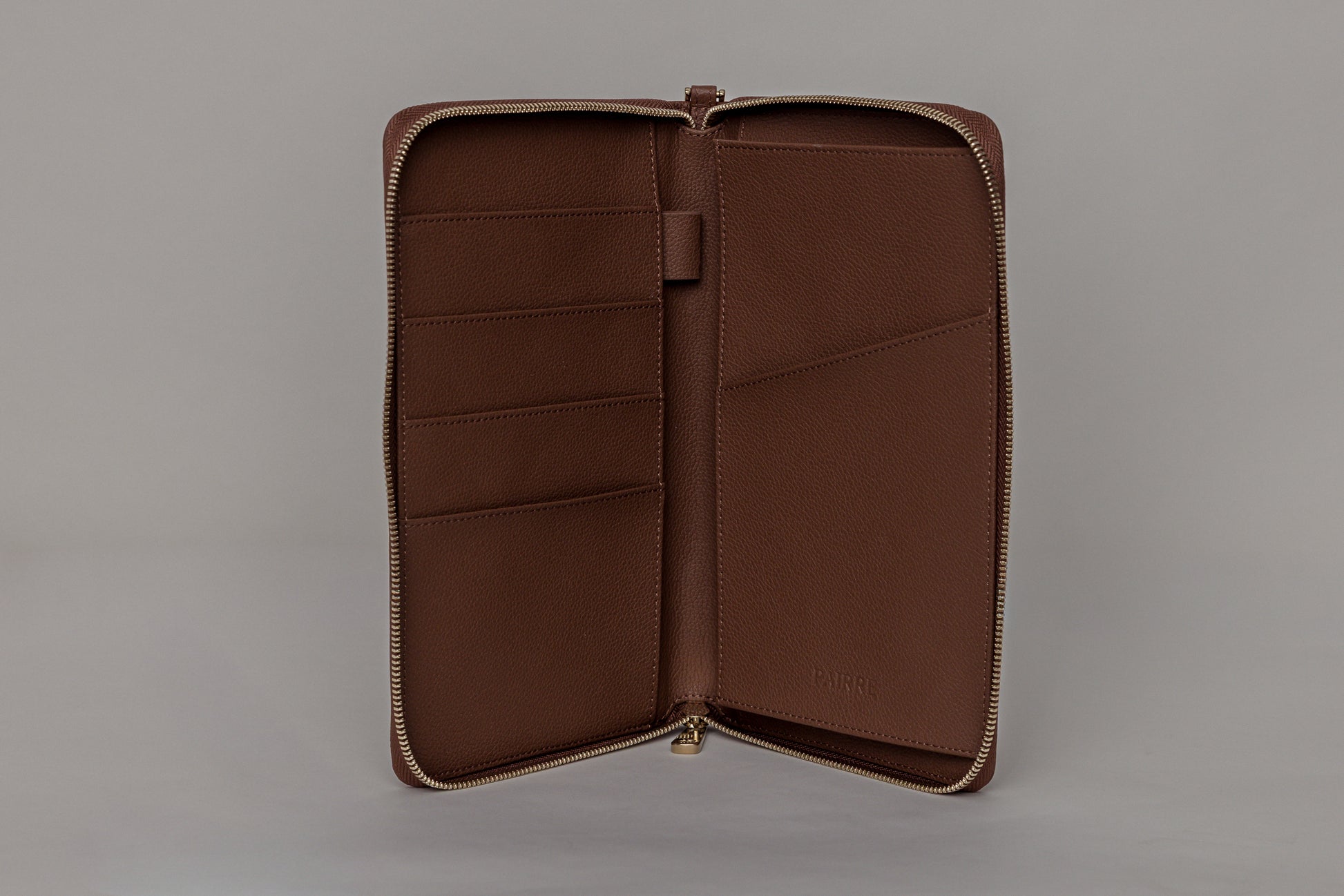 Pairre 4P passport wallet in brown leather — open interior showing four passport slots and boarding pass pocket