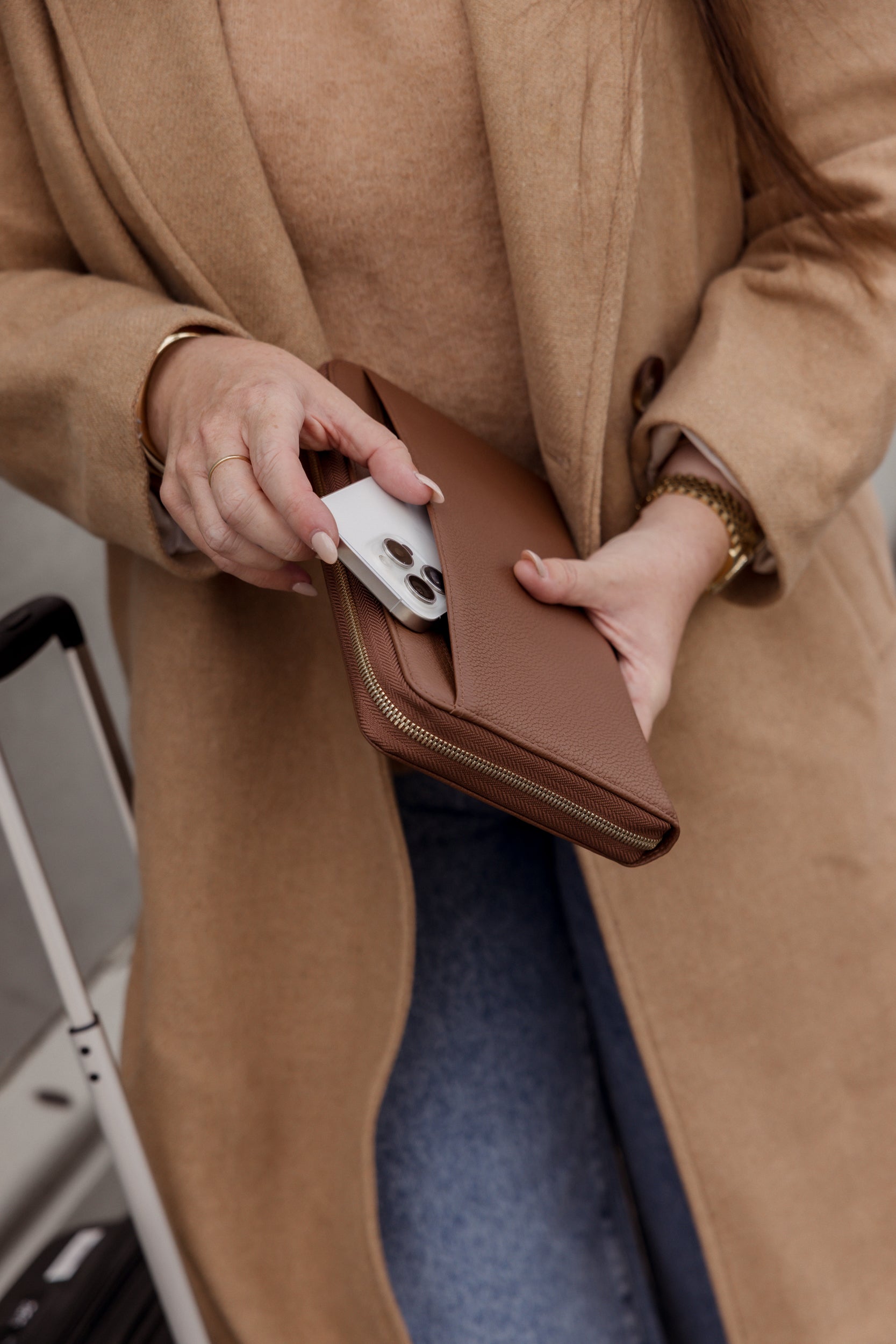 Pairre 2P passport wallet in brown full-grain leather — closed exterior showing rear slip pocket for phone or easy access passports for boarding plane